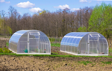 garden greenhouse with cold frame and pots.