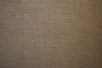 Fototapeta na wymiar Dark brown color Burlap fabric textured background