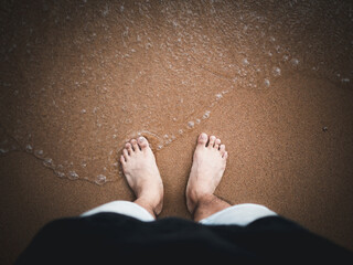 feet on the beach