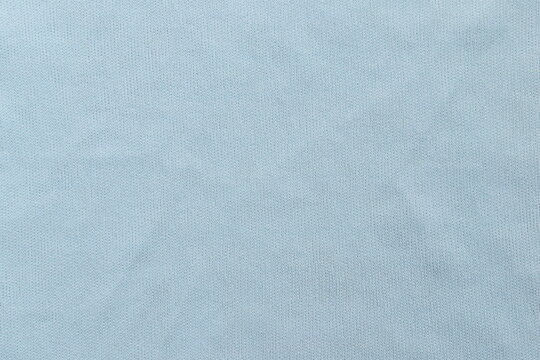 Light blue color microfiber eyeglasses cleaning cloth textured background