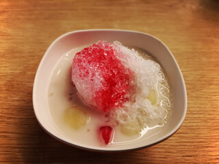 Thai shaved ice style or num-kang-sai (Jumba in the old word) is the culture food of Thailand about 100 years ago  (thapthim krøp or crisp pomegranate seeds).  