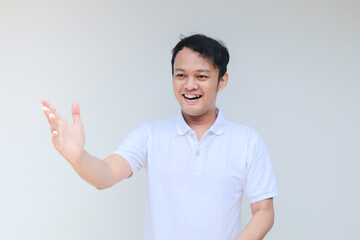 Young Asian man wear grey shirt with happy smiling face and thumbs up