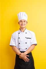 Image of Asian male chef on yellow background