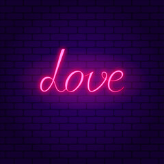 Love. Glowing pink neon incription on dark brick wall background.