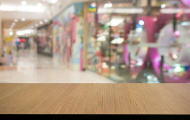 Empty wooden table in front of abstract blurred background of coffee shop . can be used for display or montage your products.Mock up for display of product