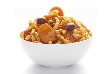 Close up of very spicy sweet Fatafat Bhel mixture Indian namkeen (snacks) on a ceramic white bowl. 