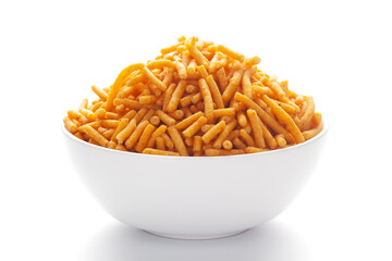 Close up of Nimbu masala besan sev Indian namkeen (snacks) on a ceramic white bowl.