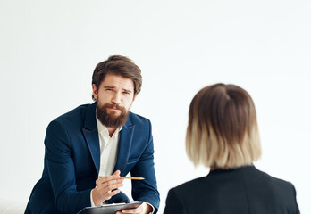 Business man for a job interview and a woman in a classic suit