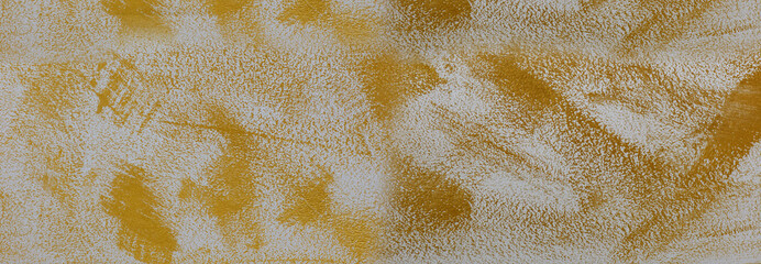 Concrete wall pant brush with gold color abstract texture background.