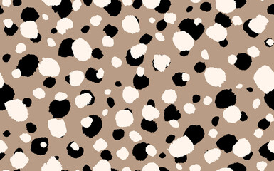Abstract modern leopard seamless pattern. Animals trendy background. Beige and black decorative vector stock illustration for print, card, postcard, fabric, textile. Modern ornament of stylized skin