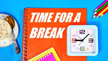Time for a break. the inscription in the planning folder on the background of the clock. Pausing an activity to relax or drink a cup of healthy drink.
