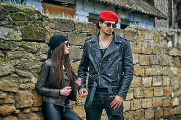 Young stylish couple in leather jackets