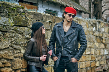 Young stylish couple in leather jackets - 426260037
