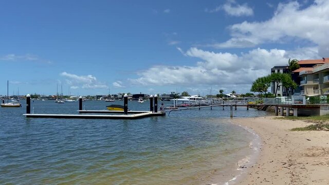 View along the tranquill shore at Maloolaba, past waterfront perpaties and private moorings