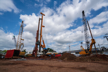 Fototapeta premium Industrial drilling rig machinery on building construction site.Drilling vehicle construction concrete piles on working
