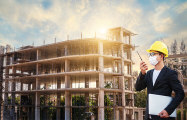 Manager Civil Engineering Construction or busines man wears a yellow helmet and faces mass. Operate...