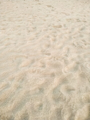 Fototapeta na wymiar Beautiful of the beach sand texture in summer sun. Background