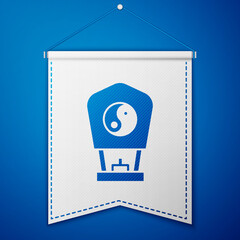 Blue Chinese paper lantern icon isolated on blue background. White pennant template. Vector