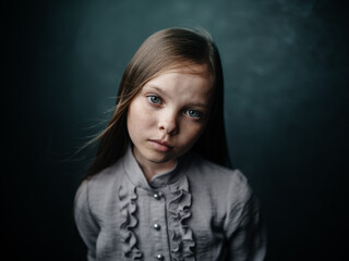vintage portrait of a girl in a dress on a dark background beautiful face cropped view