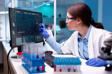 Biochemist medical engineering vaccine in microbiology laboratory, doing research. Chemistry...