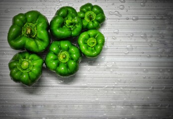 green pepper on a wooden background