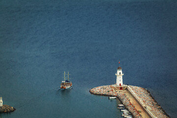 lighthouse on a large pier from the top view