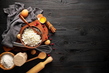 ingredients for making curd casserole on wooden background, top view, copy space