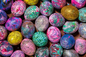 Many colorful shiny eggs. Concept of Happy Easter.