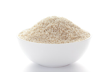 Close up of Organic White  Sesame seeds(Sesamum indicum) polished or white Til without shell inside a white ceramic bowl