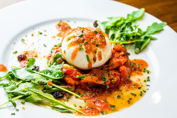 Salad with buratta cheese. italian cheese.salad with vegetables and burrata