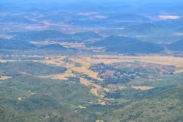 beautiful countryside of romania. sunny afternoon. wonderful springtime landscape in mountains. grassy field and rolling hills. rural scenery