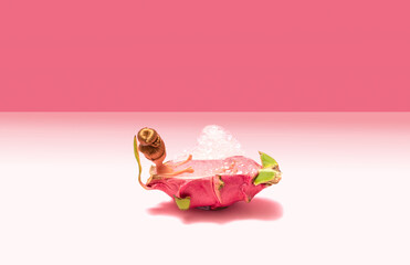Fototapeta na wymiar Minimal arrangement of fashion girl toy enjoying bubble bath with unique dragon fruit. Hot pink and pastel pink background.