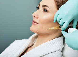 Plasmolifting injection, plasma therapy. Cosmetology procedure for woman's face skin using blood...