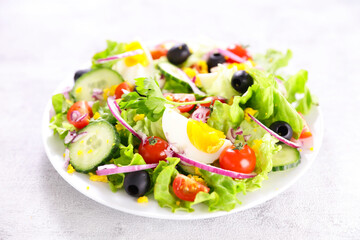 vegetable salad with egg, cucumber and tomato