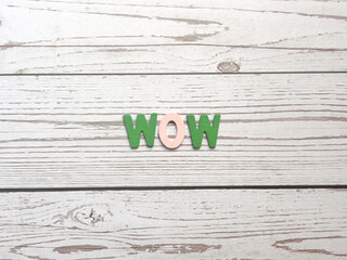 Word Wow on wood background