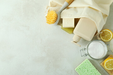 Cleaning concept with eco friendly cleaning tools on white textured table