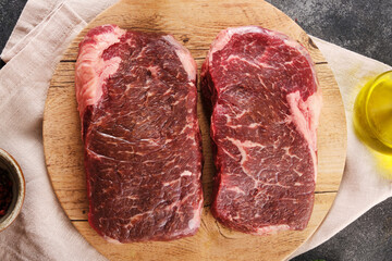 Fresh raw new-york steak top view.