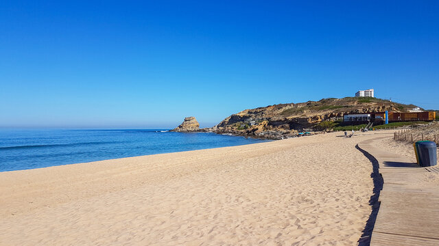 Wooden pathway or boardwalk on the wide beach