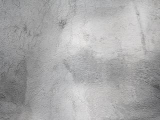 Texture of a gray wall with rough plaster. Abstract grey background.
