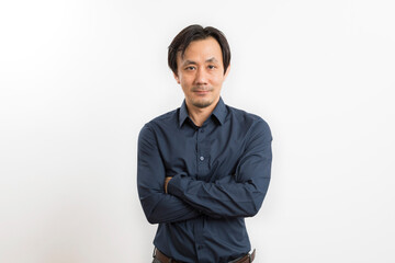 Adult handsome asian business man standing and looking to camera isolated on white background.