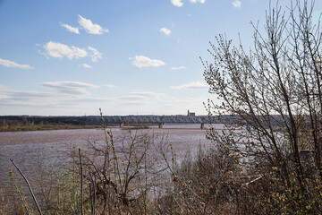 High water on a river or on a lake in sunny spring day
