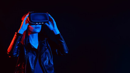 Girl wearing virtual reality glasses. Concept of future futuristic augmented reality technologies
