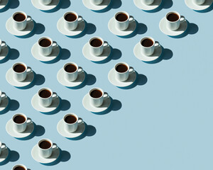 Rhythmic pattern from cups with coffee on a blue background.