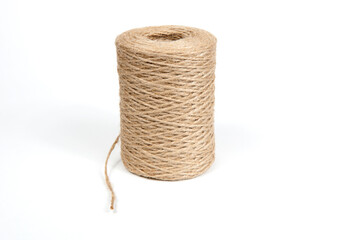 a skein of jute rope on a white background with a large plan