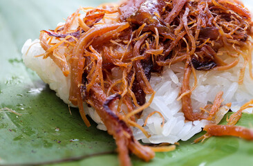 Sweet pork with sticky rice wrapped in banana leaf. Thai food delicious.