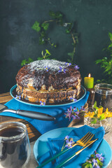 Delicious homemade cake served on wooden table. Chocolate cake food photography recipe idea