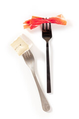 Forks with wine snacks. Soft cheese and jamon, overhead shot