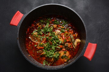 Moroccan fish  with chermoula, red peppers and preserved lemon. Spicy traditional  Moroccan food