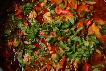 Moroccan fish  with chermoula, red peppers and preserved lemon. Spicy traditional  Moroccan food