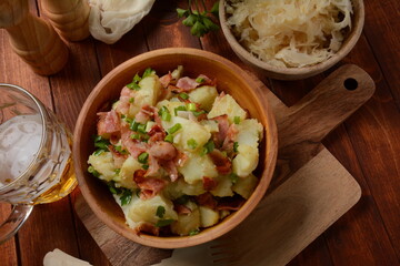 Kartoffelsalat - traditional German potato salad. Potato salad with bacon